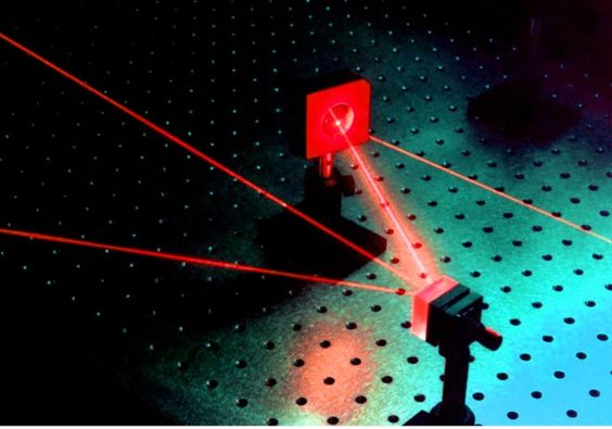DISSIPATIVE SOLITONS IN PASSIVELY MODE-LOCKED FIBER LASERS